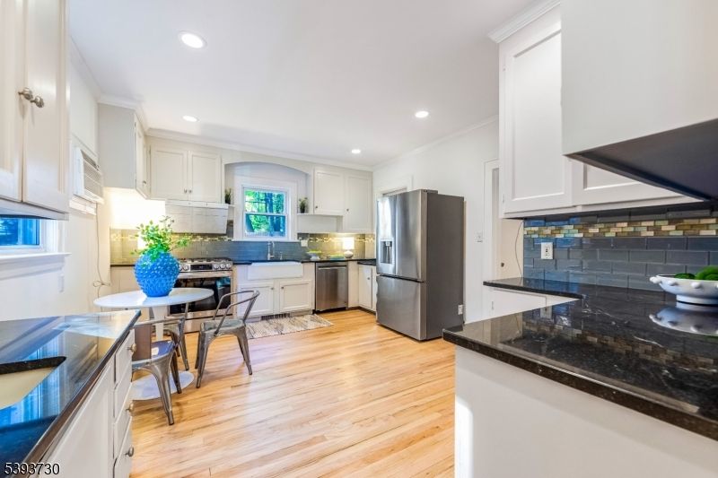 Dining room, Interior, Kitchen, Recessed Lighting, Stainless Steel Appliances, Wood Texture Flooring