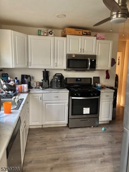 Interior, Kitchen, Tile Countertops, Wood Texture Flooring