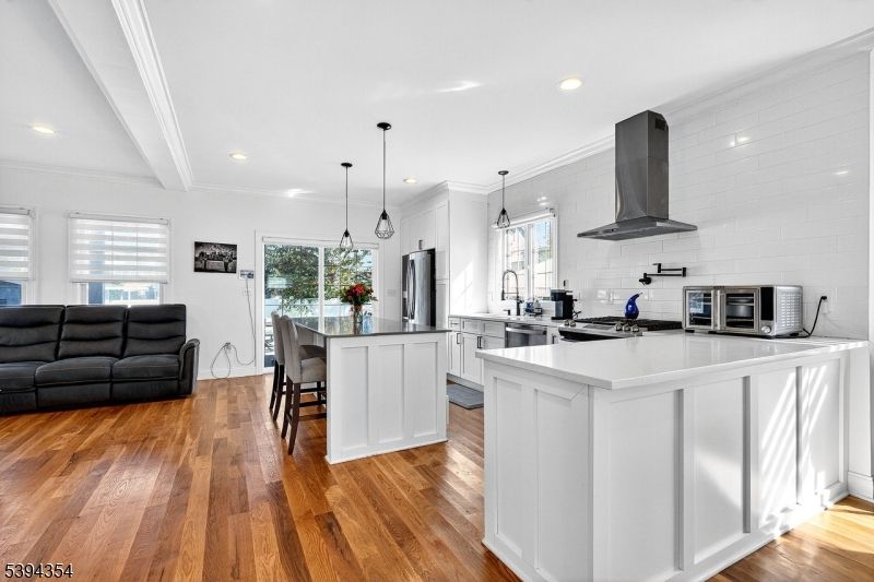 Dining room, Interior, Kitchen, Pendant Lights, Recessed Lighting, Stainless Steel Appliances, Wood Texture Flooring