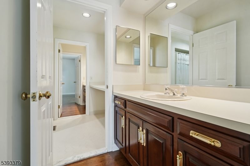 Bathroom, Dual Sink Vanities, Interior, Recessed Lighting, Wood Texture Flooring