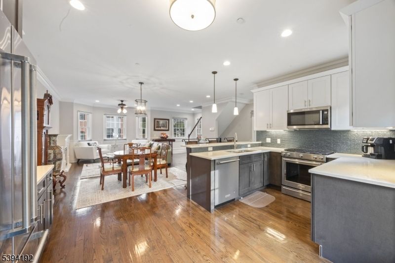 Dining room, Interior, Kitchen, Living room, Pendant Lights, Recessed Lighting, Stainless Steel Appliances, Wood Texture Flooring