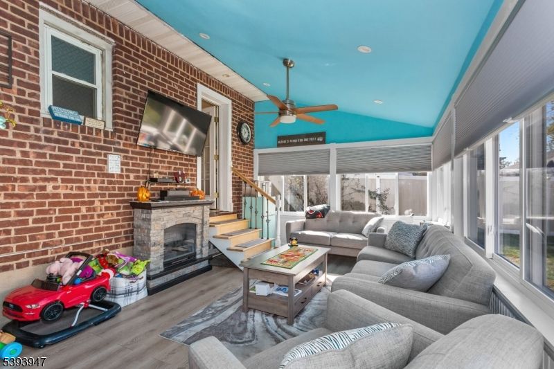 Fireplace, Interior, Living room, Recessed Lighting, Stone Walls, Wood Texture Flooring