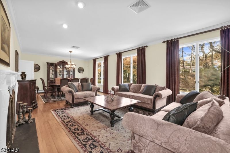 Chandelier, Dining room, Fireplace, Interior, Living room, Recessed Lighting, Wood Texture Flooring