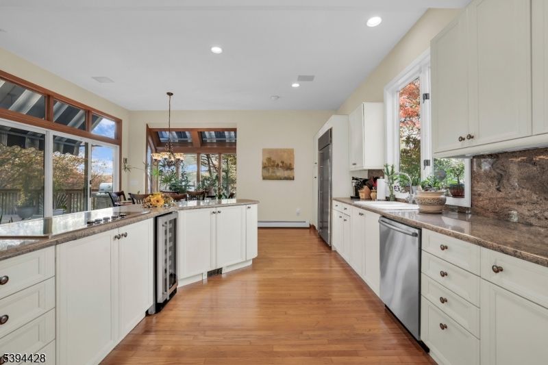 Dining room, Interior, Kitchen, Pendant Lights, Recessed Lighting, Stainless Steel Appliances, Wood Texture Flooring