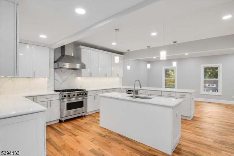 Interior, Kitchen, Marble Walls, Pendant Lights, Recessed Lighting, Stainless Steel Appliances, Wood Texture Flooring