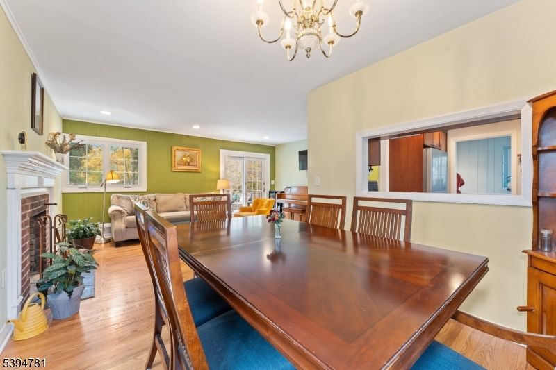 Chandelier, Dining room, Fireplace, Interior, Living room, Recessed Lighting, Wood Texture Flooring