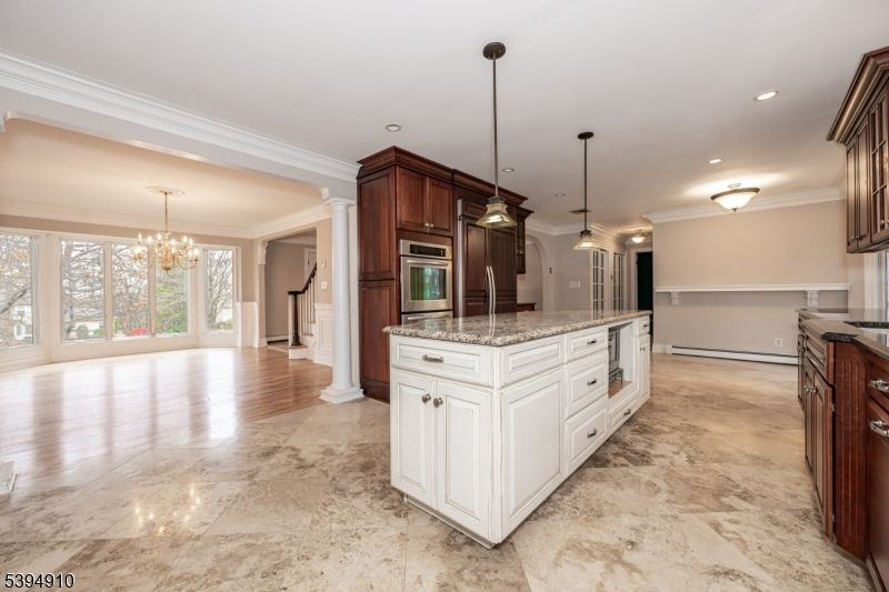 Chandelier, Empty room, Interior, Kitchen, Pendant Lights, Recessed Lighting, Stainless Steel Appliances, Wood Texture Flooring