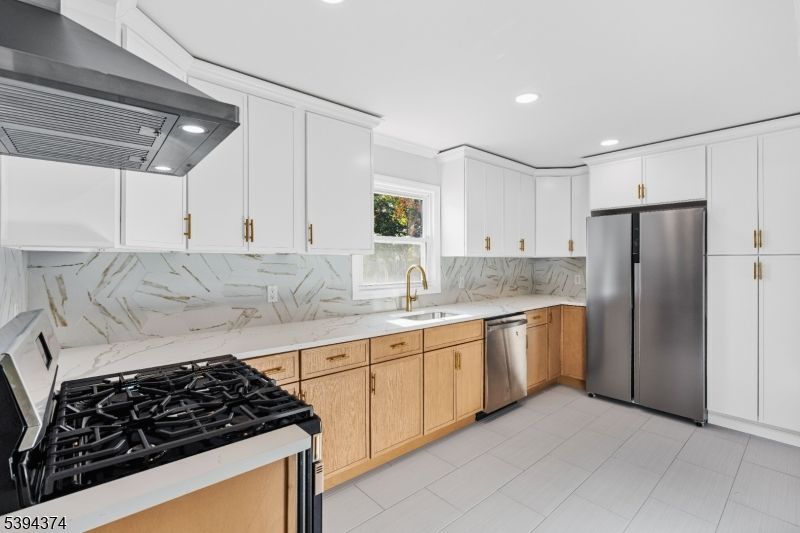 Interior, Kitchen, Marble Walls, Recessed Lighting, Stainless Steel Appliances