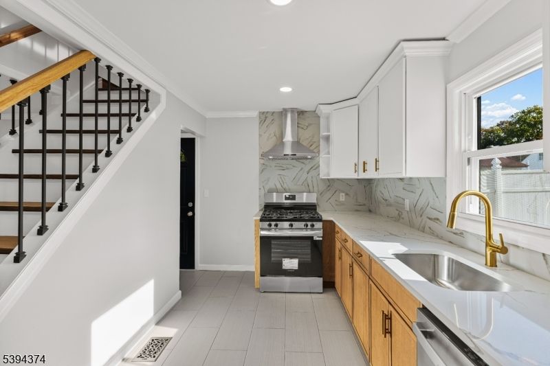 Interior, Kitchen, Marble Walls, Recessed Lighting, Stainless Steel Appliances