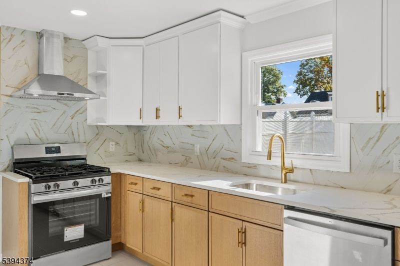 Interior, Kitchen, Marble Walls, Recessed Lighting, Stainless Steel Appliances