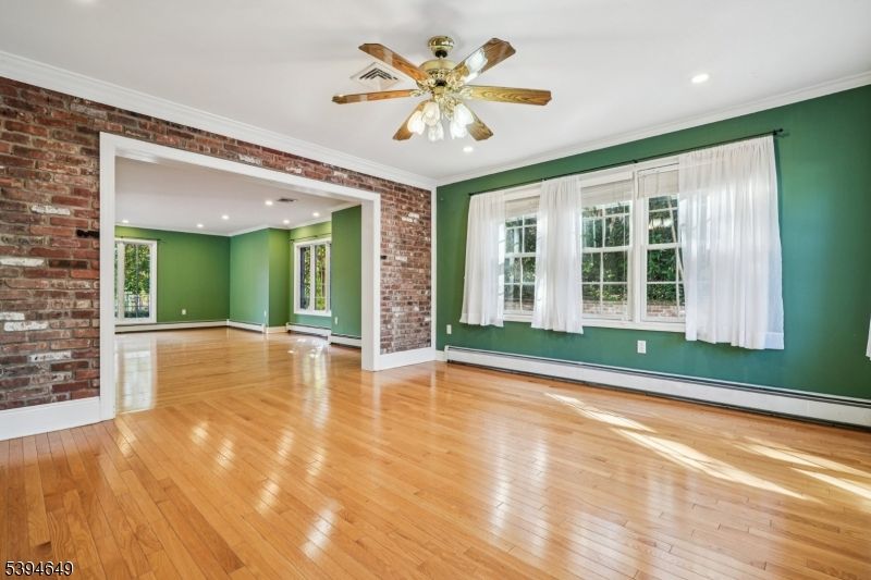 Empty room, Fireplace, Interior, Recessed Lighting, Stone Walls, Wood Texture Flooring