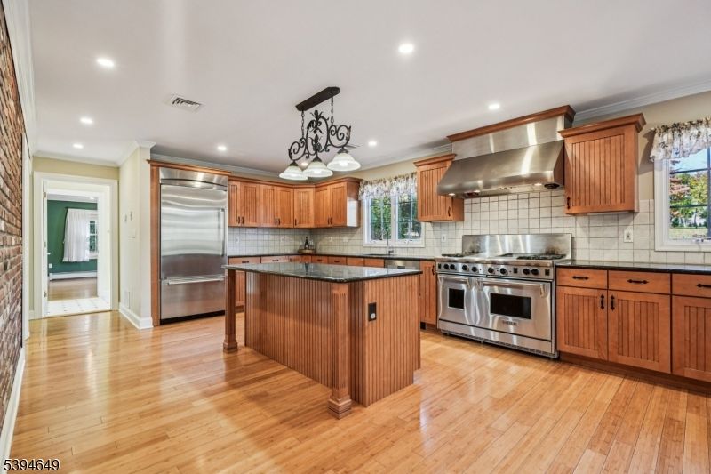 Chandelier, Interior, Kitchen, Recessed Lighting, Stainless Steel Appliances, Wood Texture Flooring