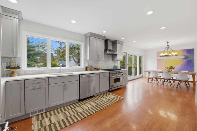 Chandelier, Dining room, Interior, Kitchen, Recessed Lighting, Stainless Steel Appliances, Wood Texture Flooring