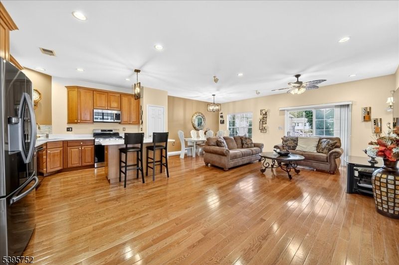 Chandelier, Dining room, Interior, Kitchen, Living room, Pendant Lights, Recessed Lighting, Stainless Steel Appliances, Wood Texture Flooring