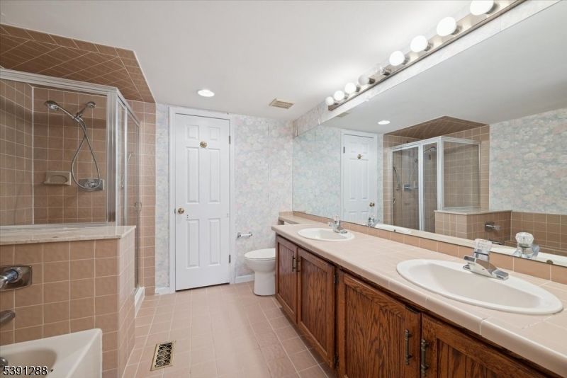 Bathroom, Dual Sink Vanities, Glass Shower, Interior, Recessed Lighting, Tile Countertops