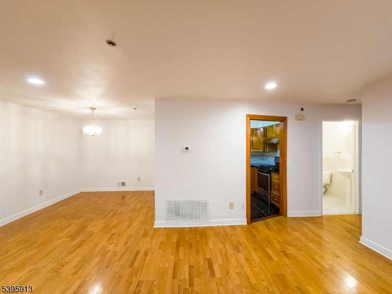 Chandelier, Empty room, Interior, Recessed Lighting, Wood Texture Flooring