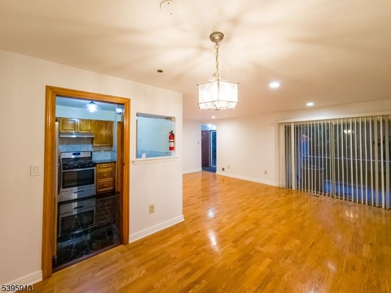 Empty room, Interior, Kitchen, Pendant Lights, Recessed Lighting, Wood Texture Flooring