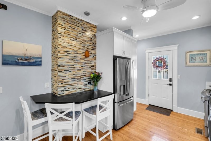 Dining room, Interior, Kitchen, Pendant Lights, Recessed Lighting, Stainless Steel Appliances, Wood Texture Flooring