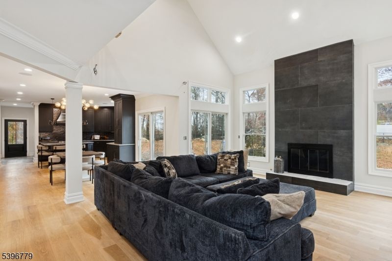 Dining room, Fireplace, Interior, Living room, Pendant Lights, Recessed Lighting, Wood Texture Flooring