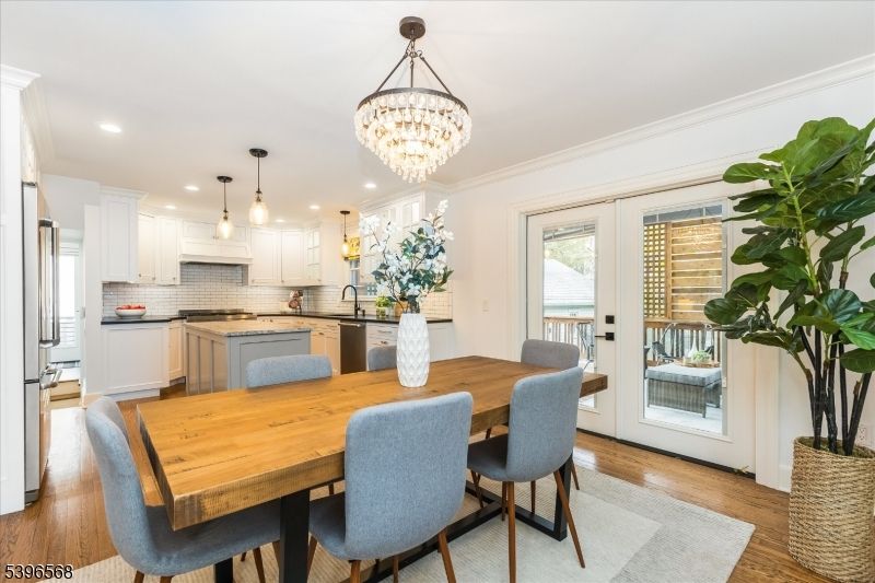 Chandelier, Dining room, Interior, Kitchen, Pendant Lights, Recessed Lighting, Stainless Steel Appliances, Wood Texture Flooring