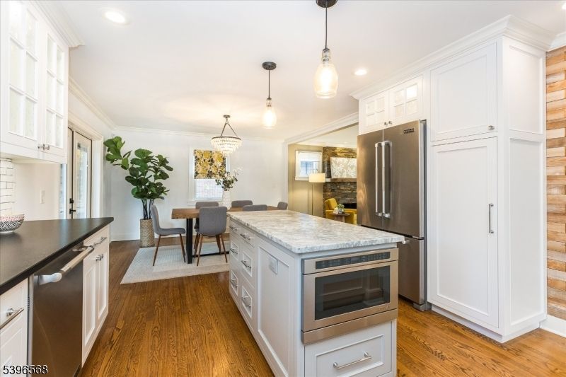 Dining room, Interior, Kitchen, Pendant Lights, Recessed Lighting, Stainless Steel Appliances, Wood Texture Flooring