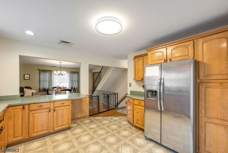 Chandelier, Dining room, Interior, Kitchen, Recessed Lighting, Stainless Steel Appliances, Wood Texture Flooring