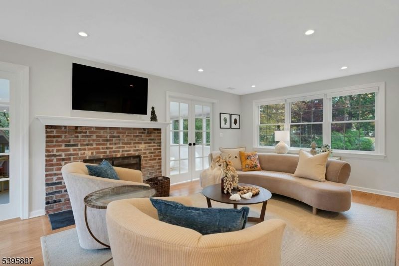 Fireplace, Interior, Living room, Recessed Lighting, Stone Walls, Wood Texture Flooring