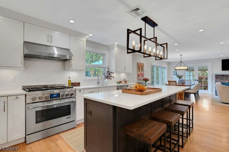 Chandelier, Dining room, Interior, Kitchen, Pendant Lights, Recessed Lighting, Stainless Steel Appliances, Wood Texture Flooring