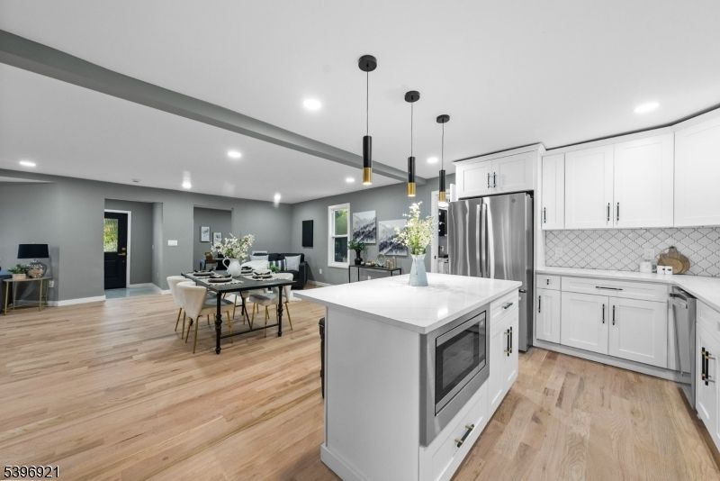 Dining room, Interior, Kitchen, Pendant Lights, Recessed Lighting, Stainless Steel Appliances, Wood Texture Flooring