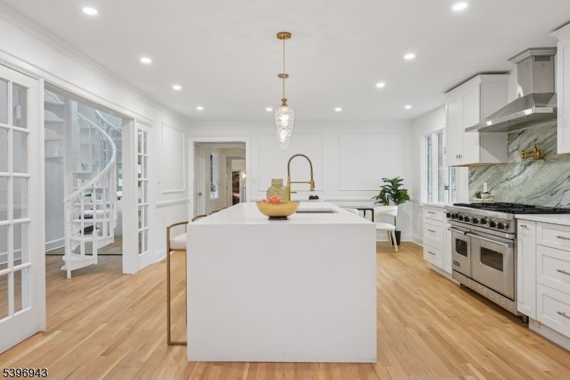 Interior, Kitchen, Marble Walls, Pendant Lights, Recessed Lighting, Stainless Steel Appliances, Wood Texture Flooring