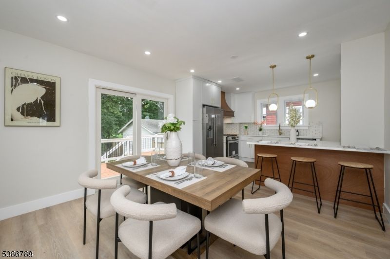 Dining room, Interior, Kitchen, Pendant Lights, Recessed Lighting, Stainless Steel Appliances, Wood Texture Flooring