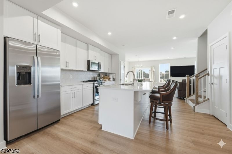 Chandelier, Interior, Kitchen, Recessed Lighting, Stainless Steel Appliances, Wood Texture Flooring