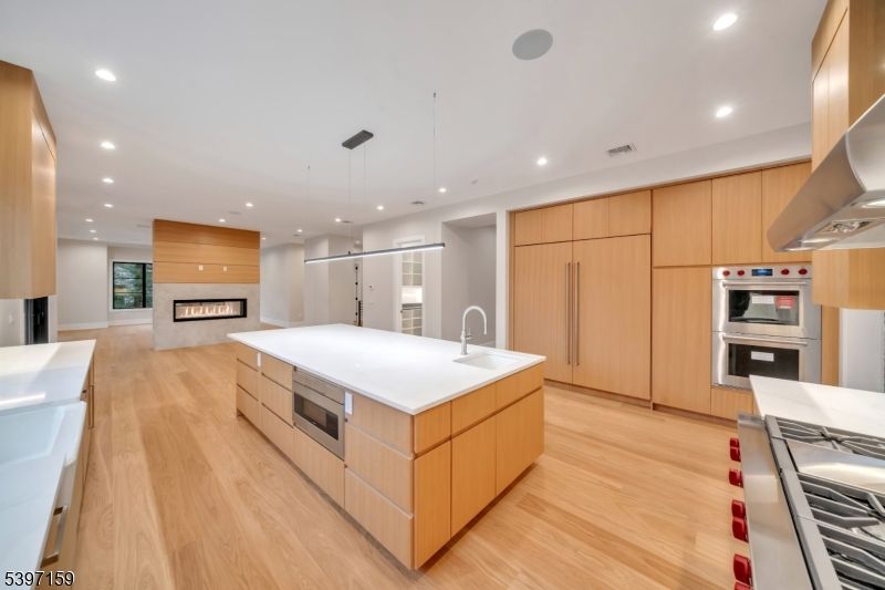 Fireplace, Interior, Kitchen, Pendant Lights, Recessed Lighting, Stainless Steel Appliances, Wood Texture Flooring