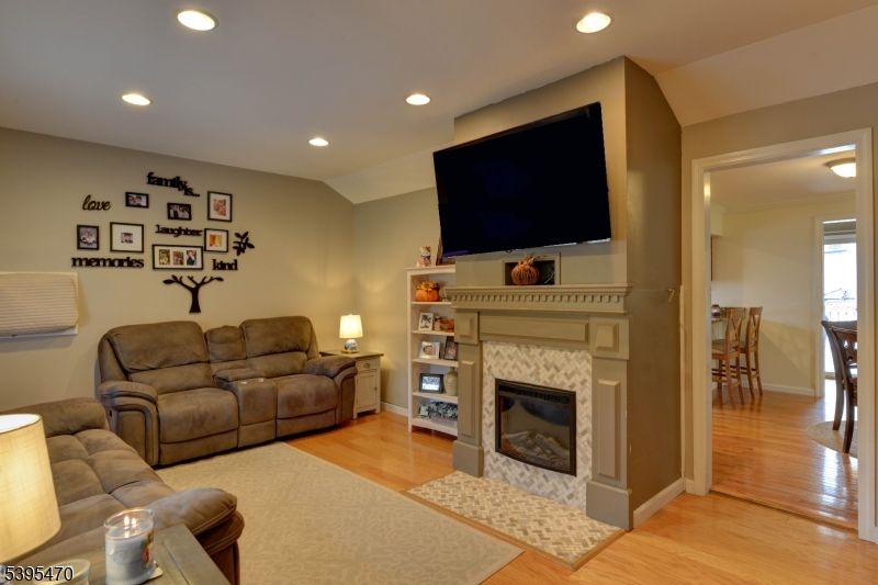 Fireplace, Interior, Living room, Recessed Lighting, Wood Texture Flooring