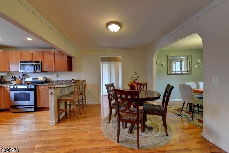 Dining room, Interior, Kitchen, Recessed Lighting, Stainless Steel Appliances, Wood Texture Flooring