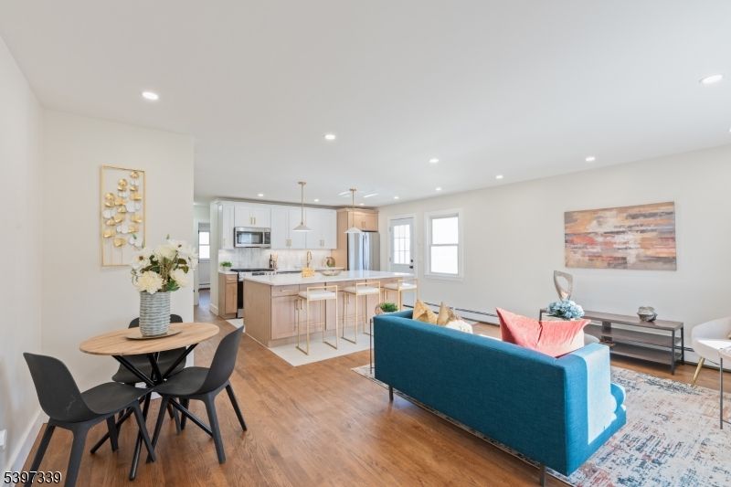 Dining room, Interior, Kitchen, Living room, Pendant Lights, Recessed Lighting, Stainless Steel Appliances, Wood Texture Flooring