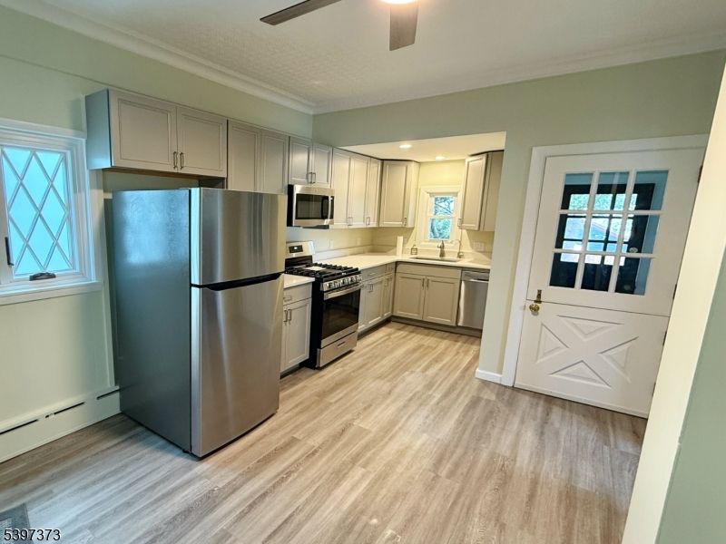 Interior, Kitchen, Recessed Lighting, Stainless Steel Appliances, Wood Texture Flooring