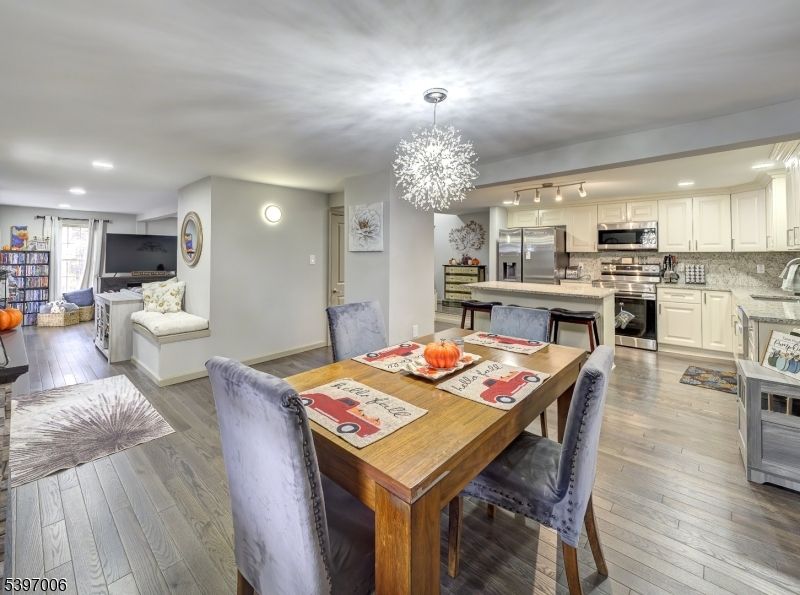 Chandelier, Dining room, Interior, Kitchen, Living room, Recessed Lighting, Stainless Steel Appliances, Wood Texture Flooring