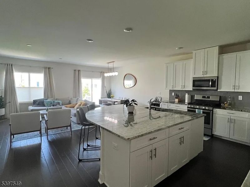 Dining room, Interior, Kitchen, Living room, Pendant Lights, Recessed Lighting, Stainless Steel Appliances, Wood Texture Flooring