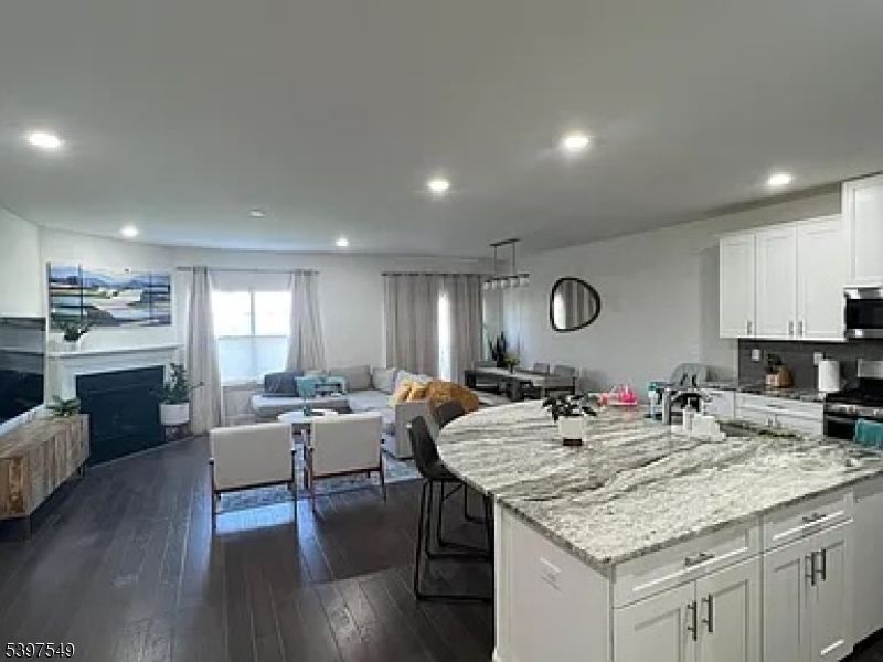 Dining room, Fireplace, Interior, Kitchen, Living room, Pendant Lights, Recessed Lighting, Wood Texture Flooring