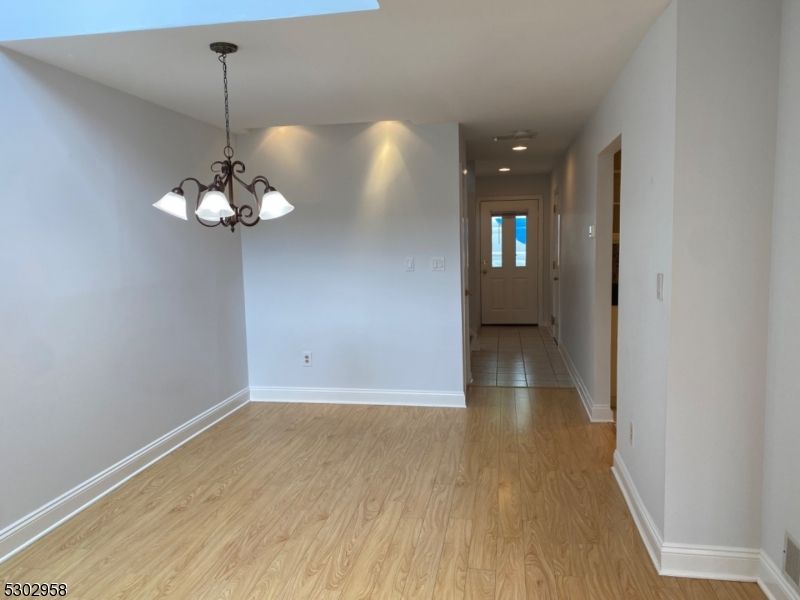 Chandelier, Empty room, Interior, Recessed Lighting, Wood Texture Flooring