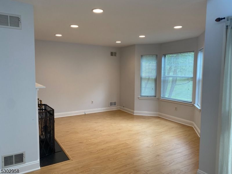 Empty room, Fireplace, Interior, Recessed Lighting, Wood Texture Flooring