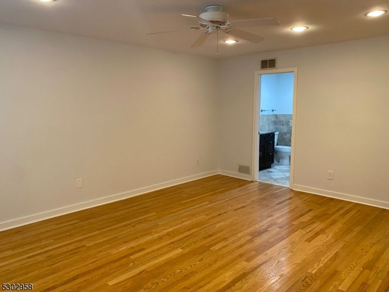 Empty room, Fireplace, Interior, Recessed Lighting, Wood Texture Flooring