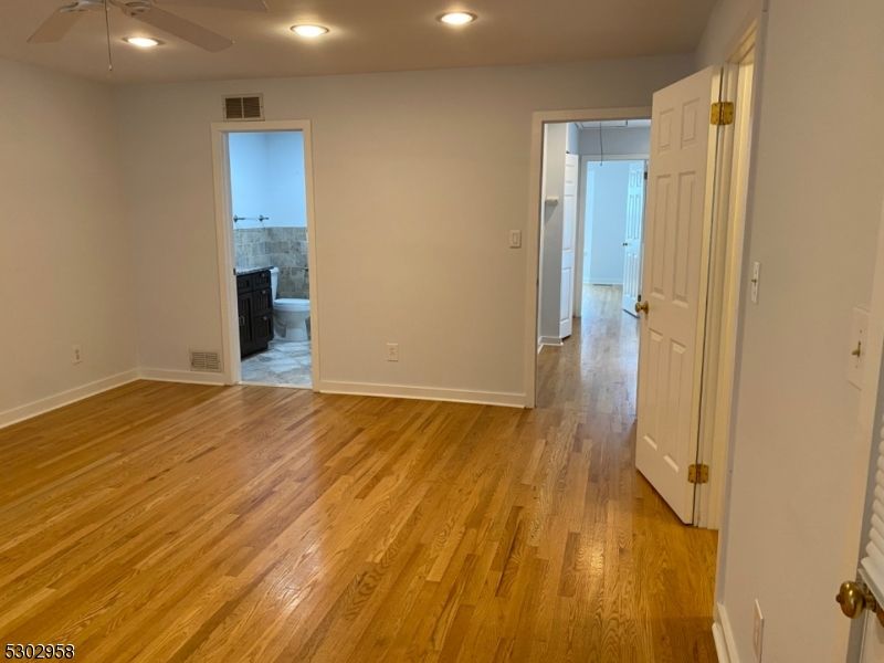 Empty room, Fireplace, Interior, Recessed Lighting, Wood Texture Flooring