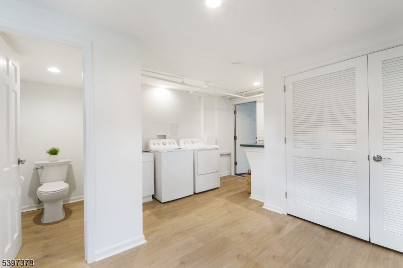 Bathroom, Interior, Recessed Lighting, Washer, Wood Texture Flooring