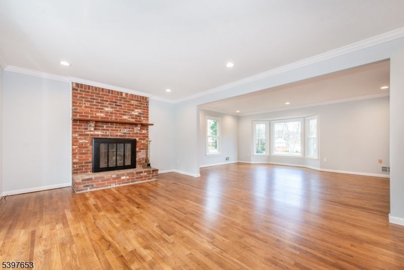 Empty room, Fireplace, Interior, Recessed Lighting, Stone Walls, Wood Texture Flooring