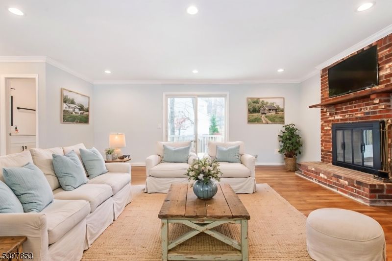 Fireplace, Interior, Living room, Recessed Lighting, Stone Walls, Wood Texture Flooring