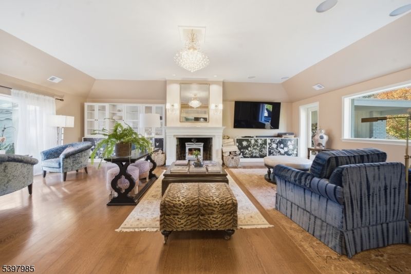 Chandelier, Fireplace, Interior, Living room, Recessed Lighting, Wood Texture Flooring