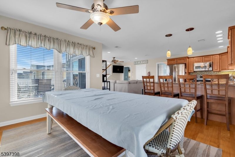 Dining room, Interior, Kitchen, Pendant Lights, Recessed Lighting, Stainless Steel Appliances, Wood Texture Flooring