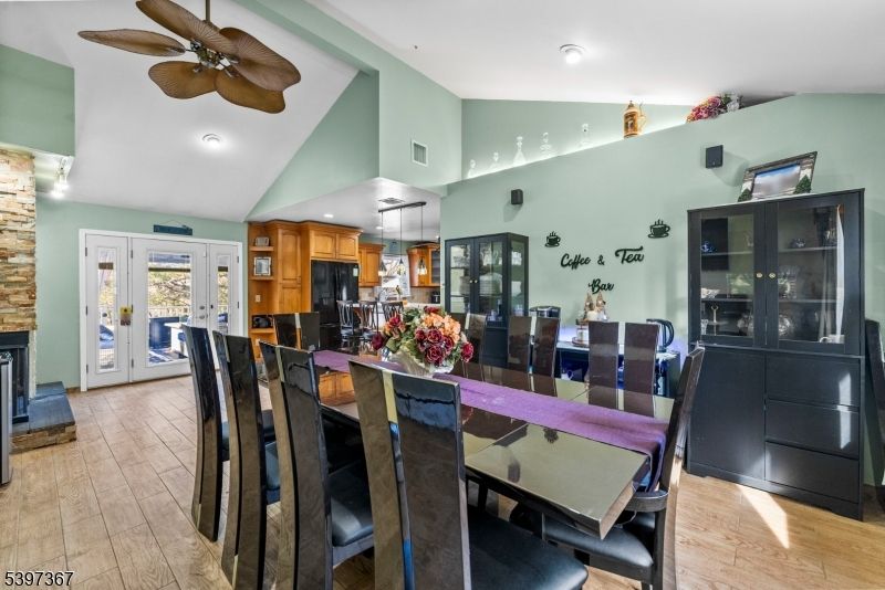 Dining room, Fireplace, Interior, Kitchen, Recessed Lighting, Wood Texture Flooring